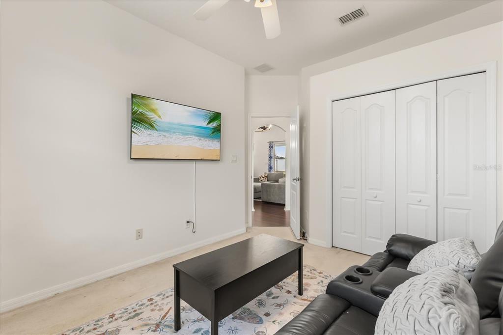 2309 Wolf Ridge Lane Mount Dora, FL 32757 - Photo 19 of 36 a living room with furniture and a rug