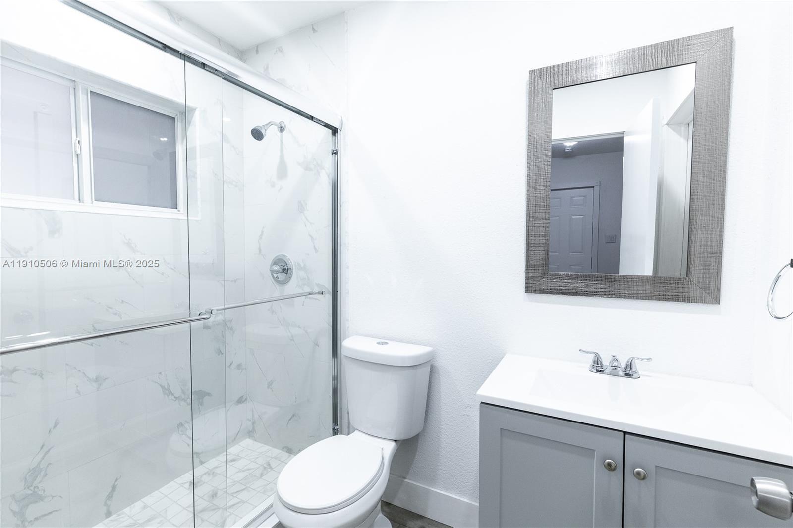 6440 Southwest 20th Street Miramar, FL 33023 - Photo 12 of 31 a bathroom with a sink a toilet and shower