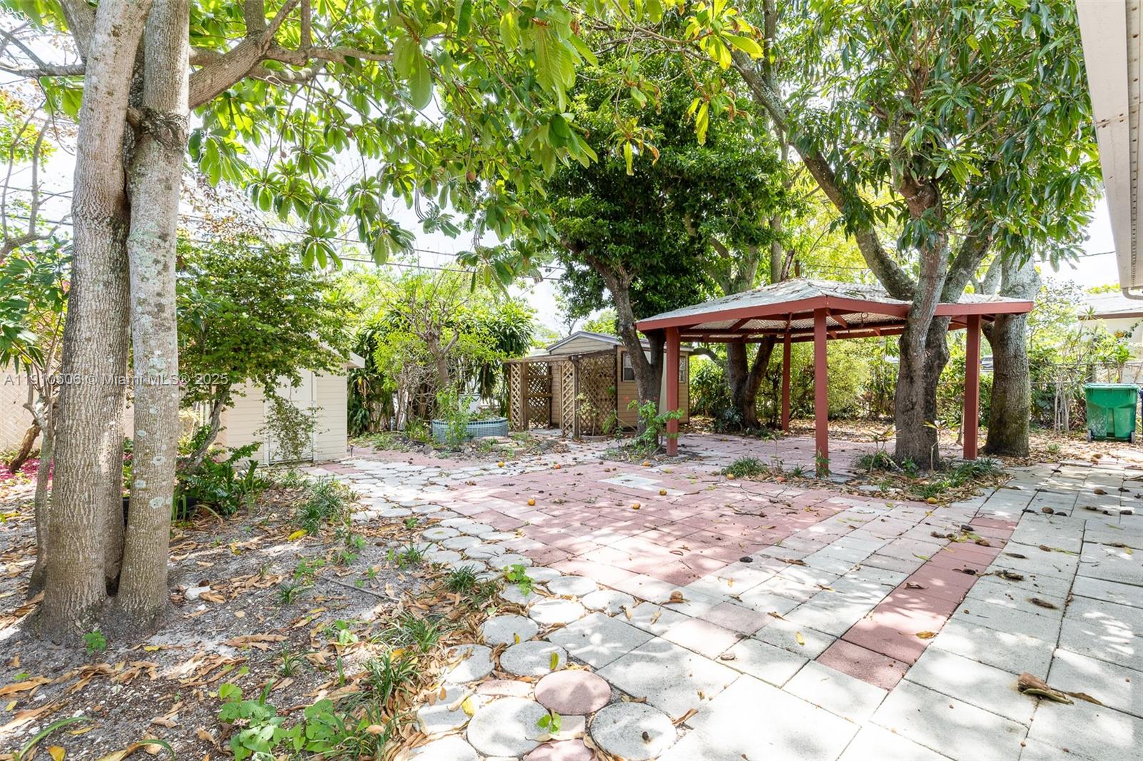 6440 Southwest 20th Street Miramar, FL 33023 - Photo 15 of 31 a view of a wooden house with a yard