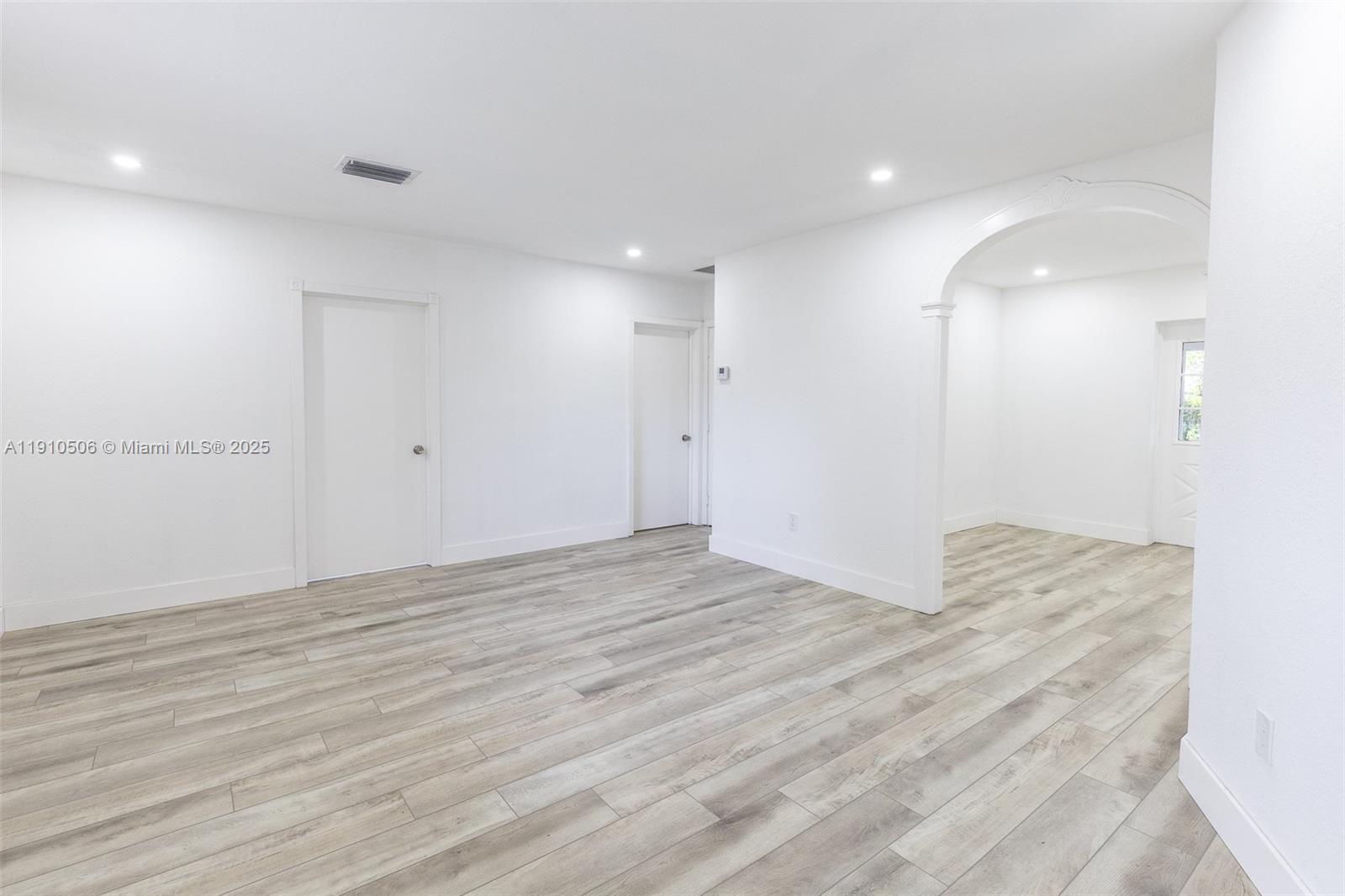 6440 Southwest 20th Street Miramar, FL 33023 - Photo 16 of 31 a view of empty room with wooden floor