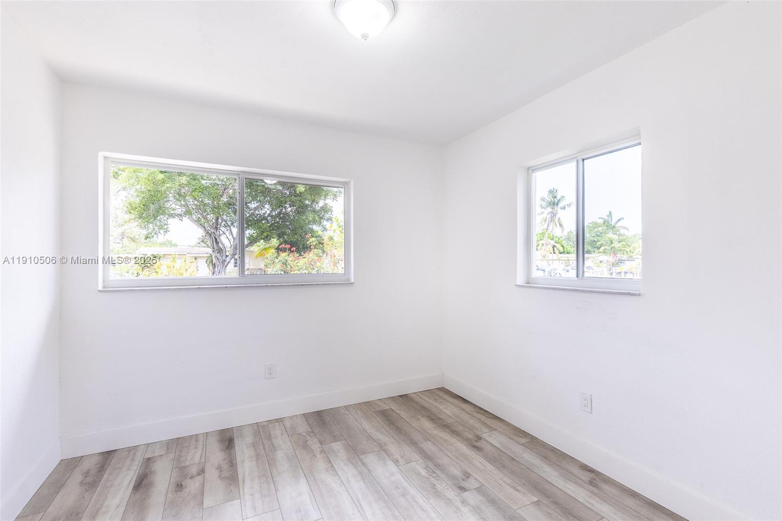 6440 Southwest 20th Street Miramar, FL 33023 - Photo 6 of 31 an empty room with a window