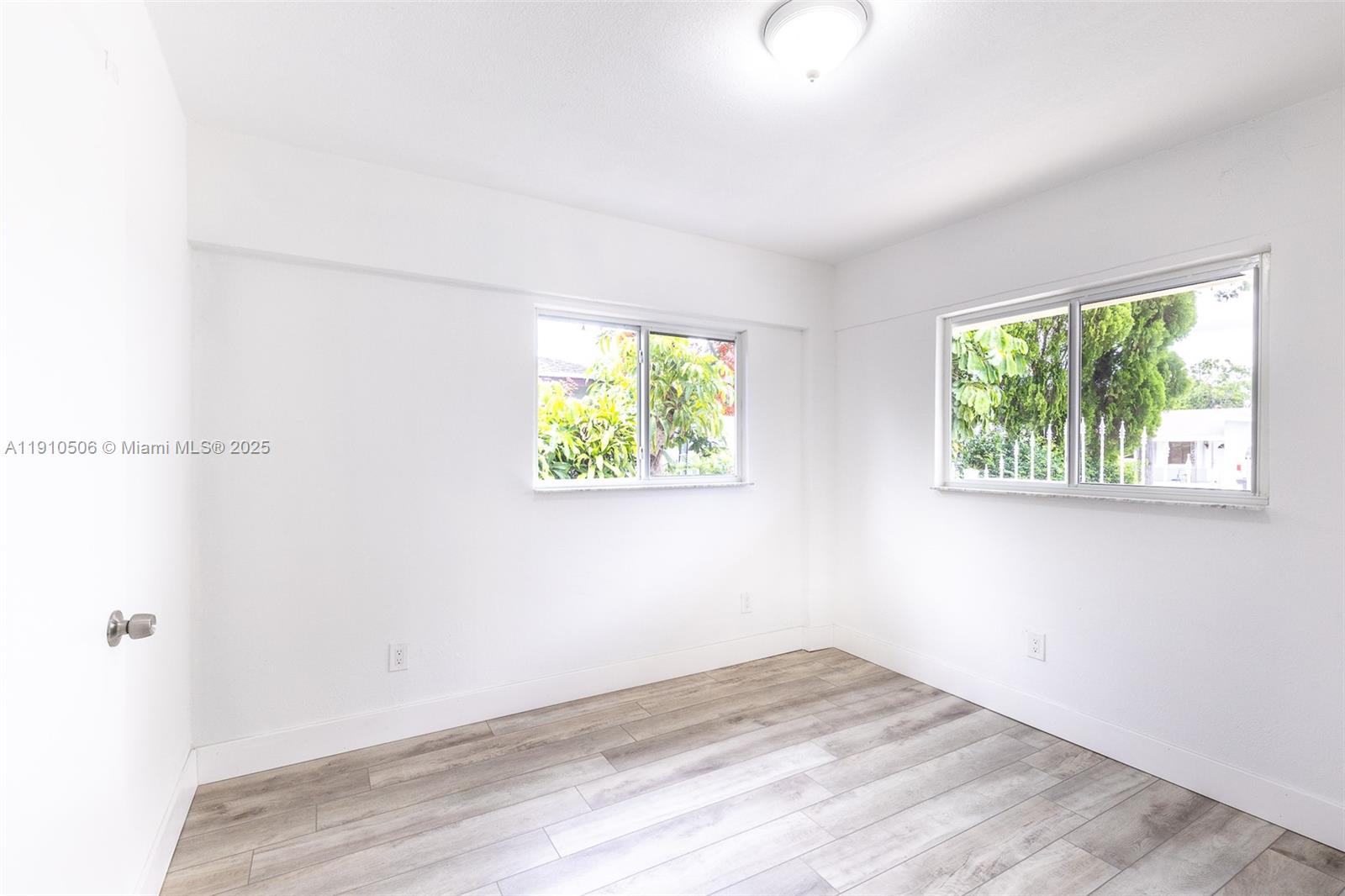 6440 Southwest 20th Street Miramar, FL 33023 - Photo 7 of 31 an empty room with windows