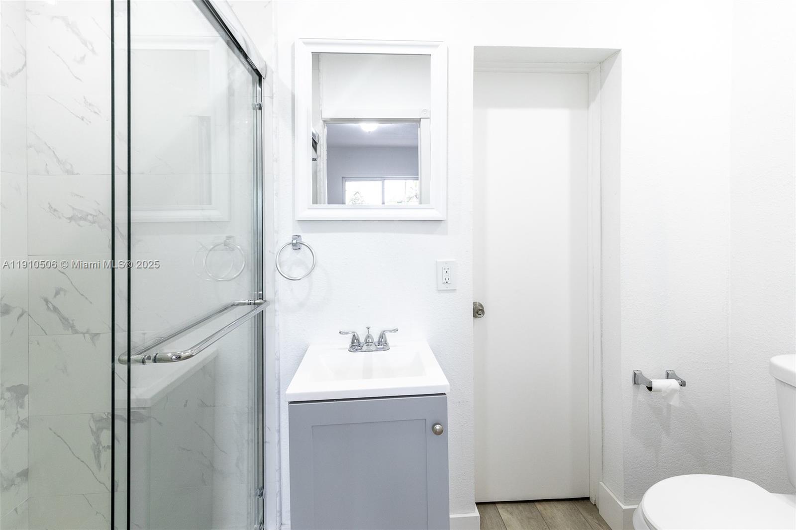 6440 Southwest 20th Street Miramar, FL 33023 - Photo 9 of 31 a bathroom with a sink toilet and shower