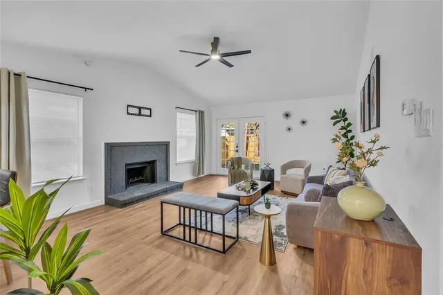 a living room with furniture and a fireplace