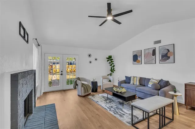 a living room with furniture and a fireplace