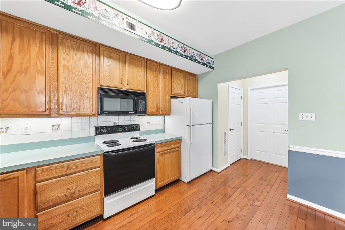 1588 Nicklaus Drive Springfield, PA 19064 - Photo 12 of 25 a kitchen with appliances cabinets and a counter top space