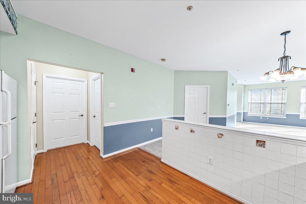 1588 Nicklaus Drive Springfield, PA 19064 - Photo 13 of 25 a spacious bedroom with a bed and wooden floor