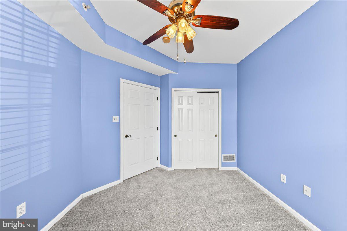 1588 Nicklaus Drive Springfield, PA 19064 - Photo 21 of 25 a view of an empty room and chandelier fan