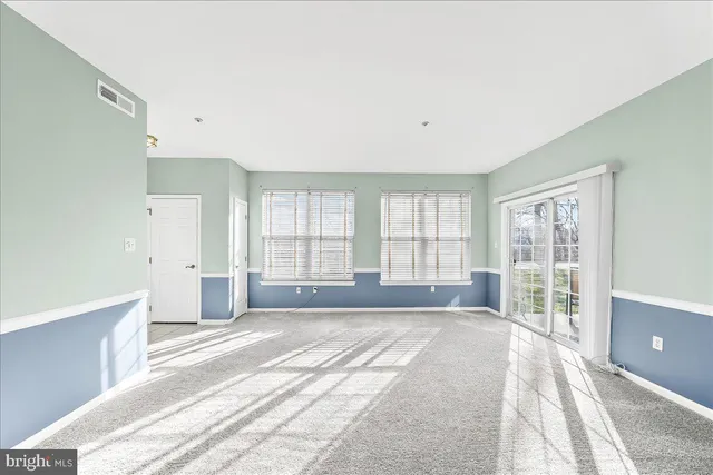 a bedroom with a bed and cabinets