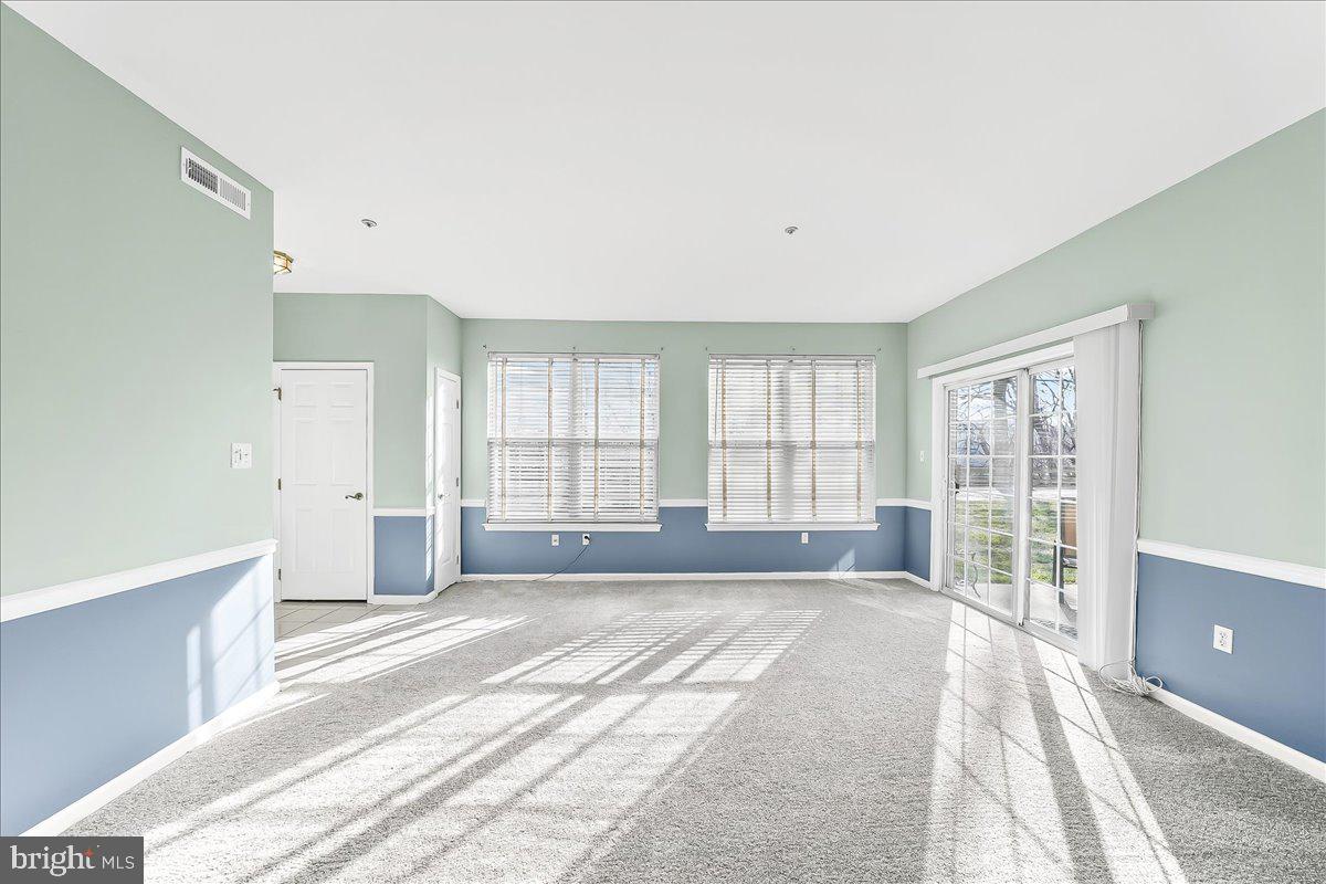 1588 Nicklaus Drive Springfield, PA 19064 - Photo 4 of 25 a spacious bedroom with a large bed and a large window