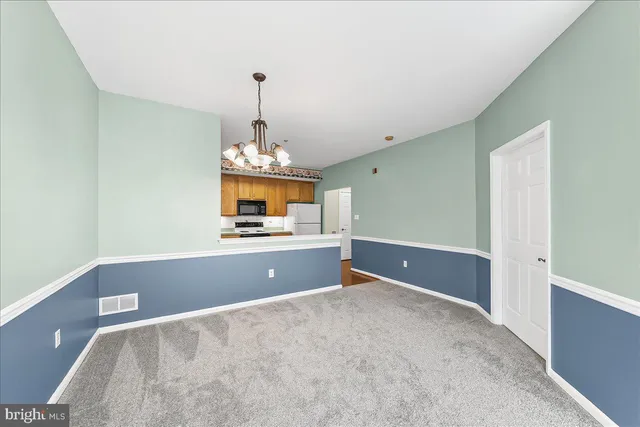 a view of empty room with windows