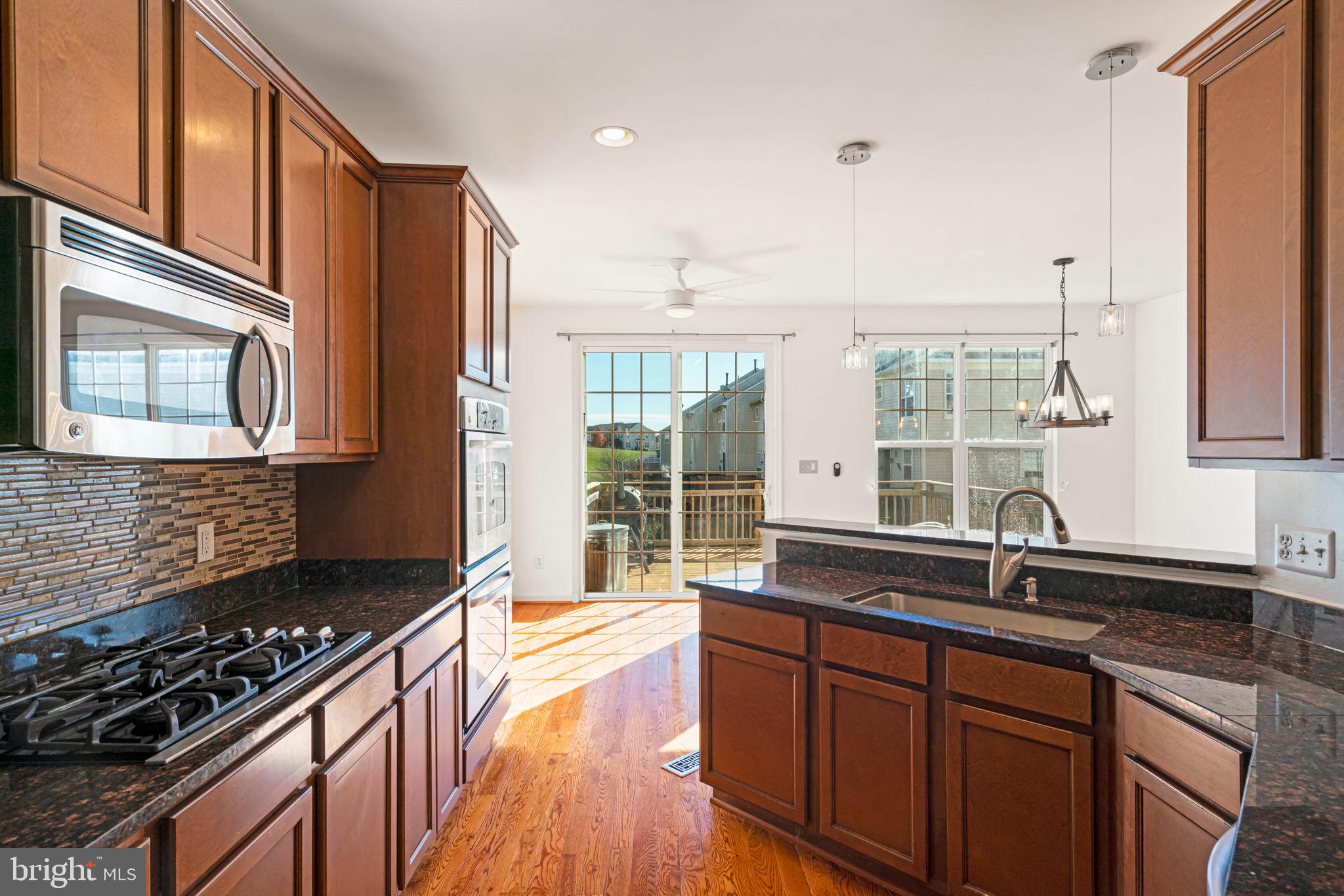 11929 Benton Lake Road Bristow, VA 20136 - Photo 13 of 23 Kitchen to breakfast area and deck