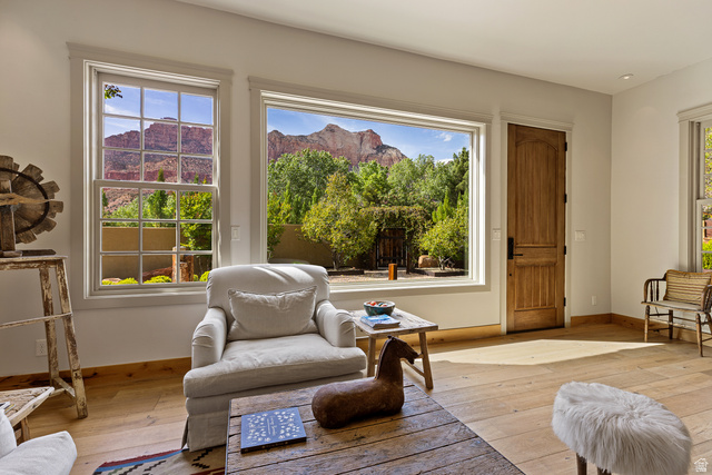 105 River Bend Circle, Unit 105 Springdale, UT 84767 - Photo 3 of 56 Expansive picture window framing mountain scenery and mature landscaping