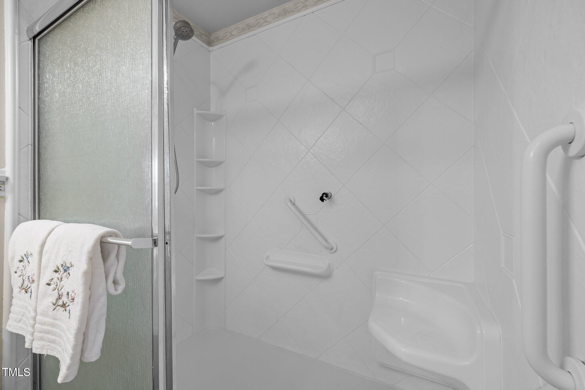 1613 Bulon Drive Cary, NC 27518 - Photo 12 of 26 a bathroom with a bathtub