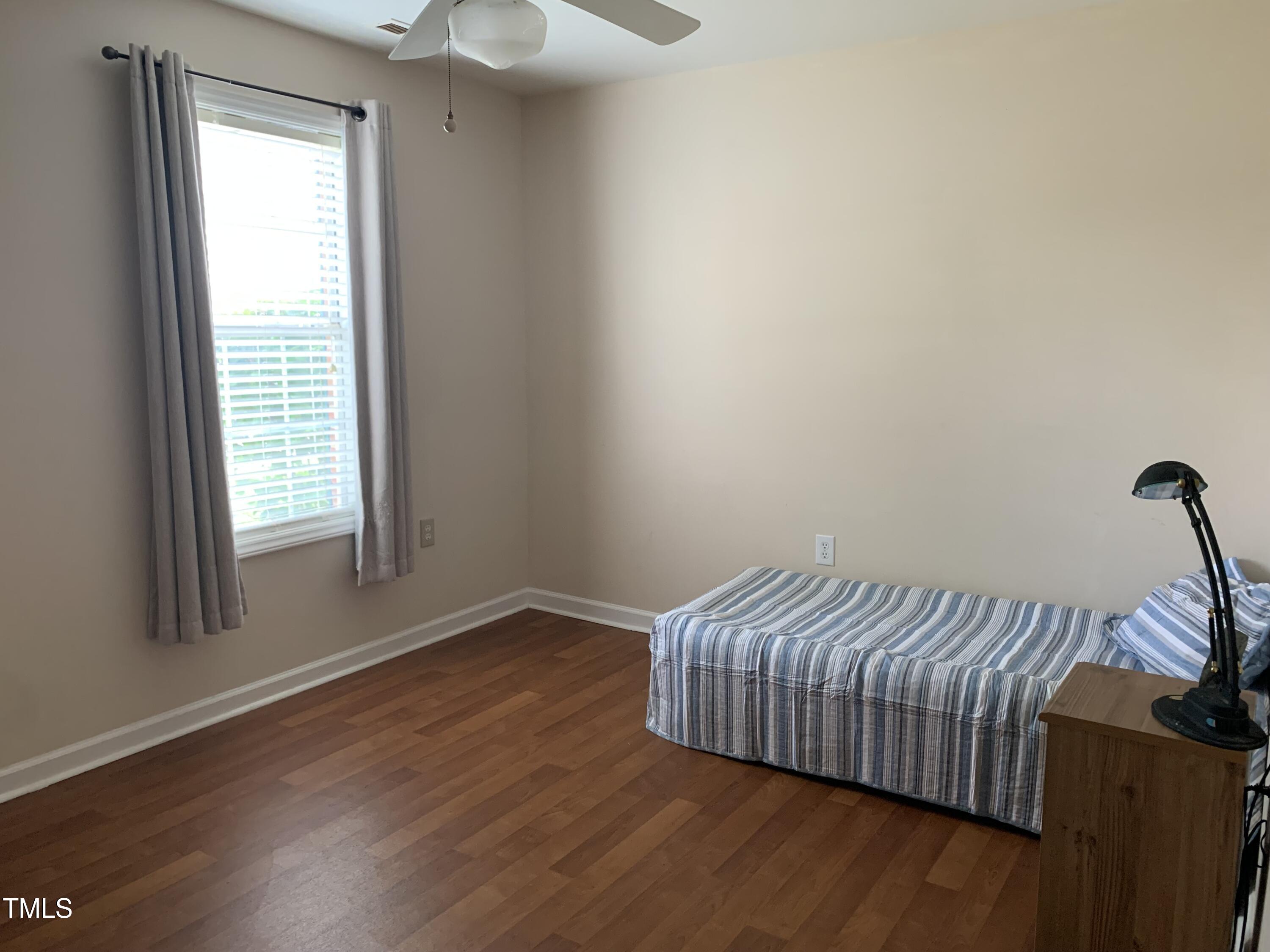 1613 Bulon Drive Cary, NC 27518 - Photo 13 of 26 a view of bedroom with furniture and wooden floor
