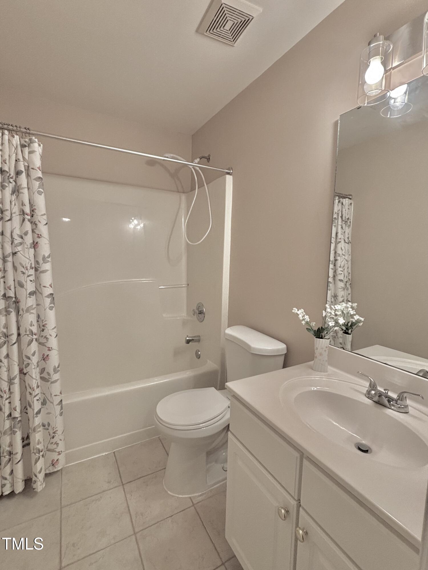1613 Bulon Drive Cary, NC 27518 - Photo 14 of 26 a bathroom with a sink toilet and shower