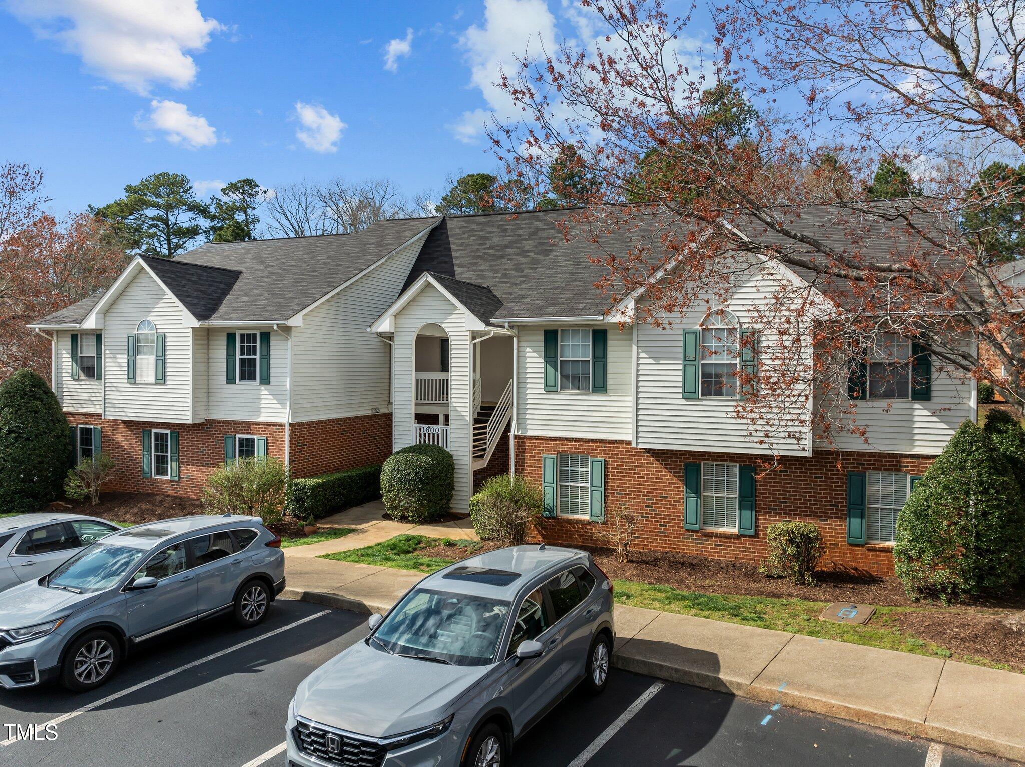 1613 Bulon Drive Cary, NC 27518 - Photo 18 of 26 a front view of a house with a yard and outdoor seating