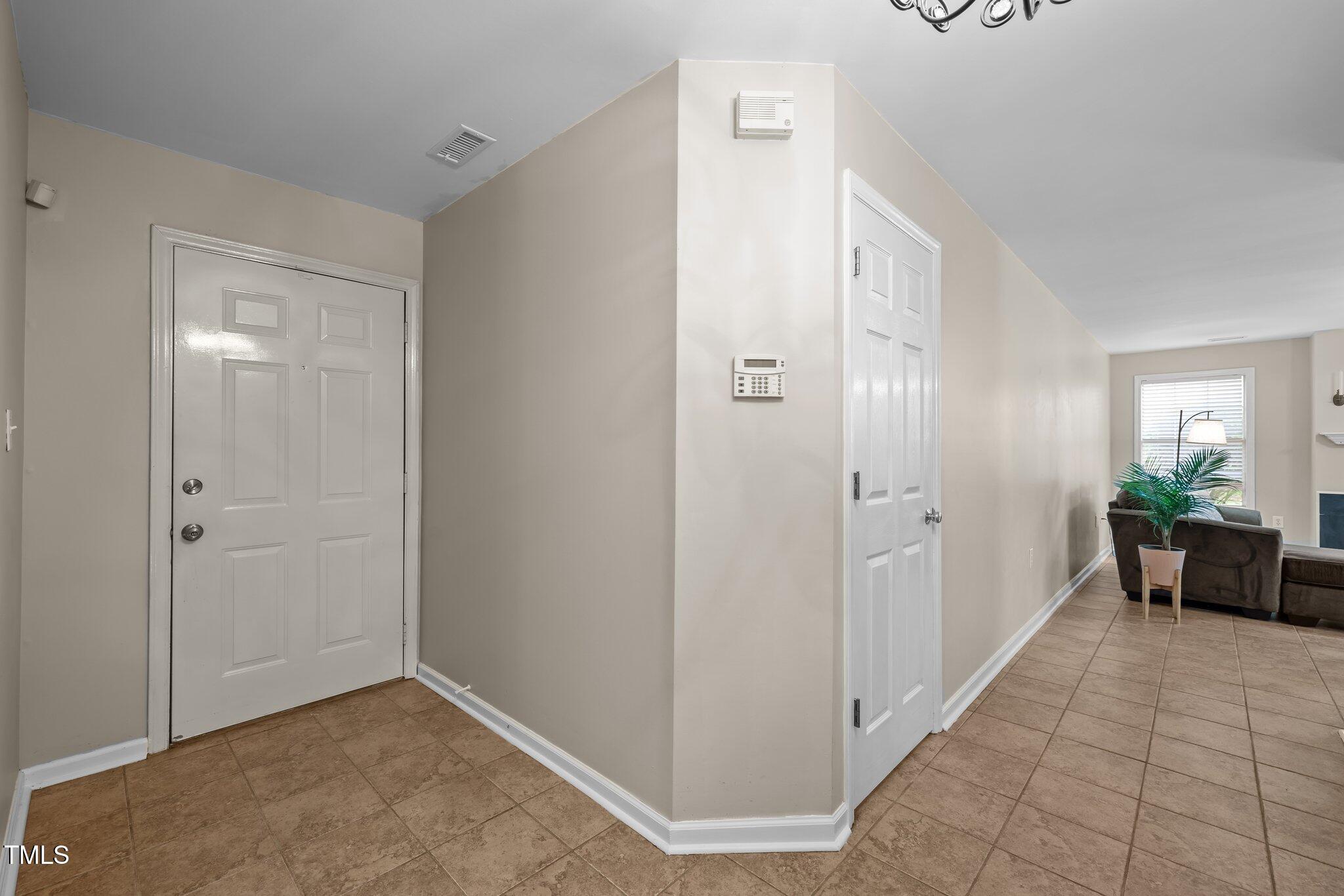 1613 Bulon Drive Cary, NC 27518 - Photo 8 of 26 a view of a hallway to rooms