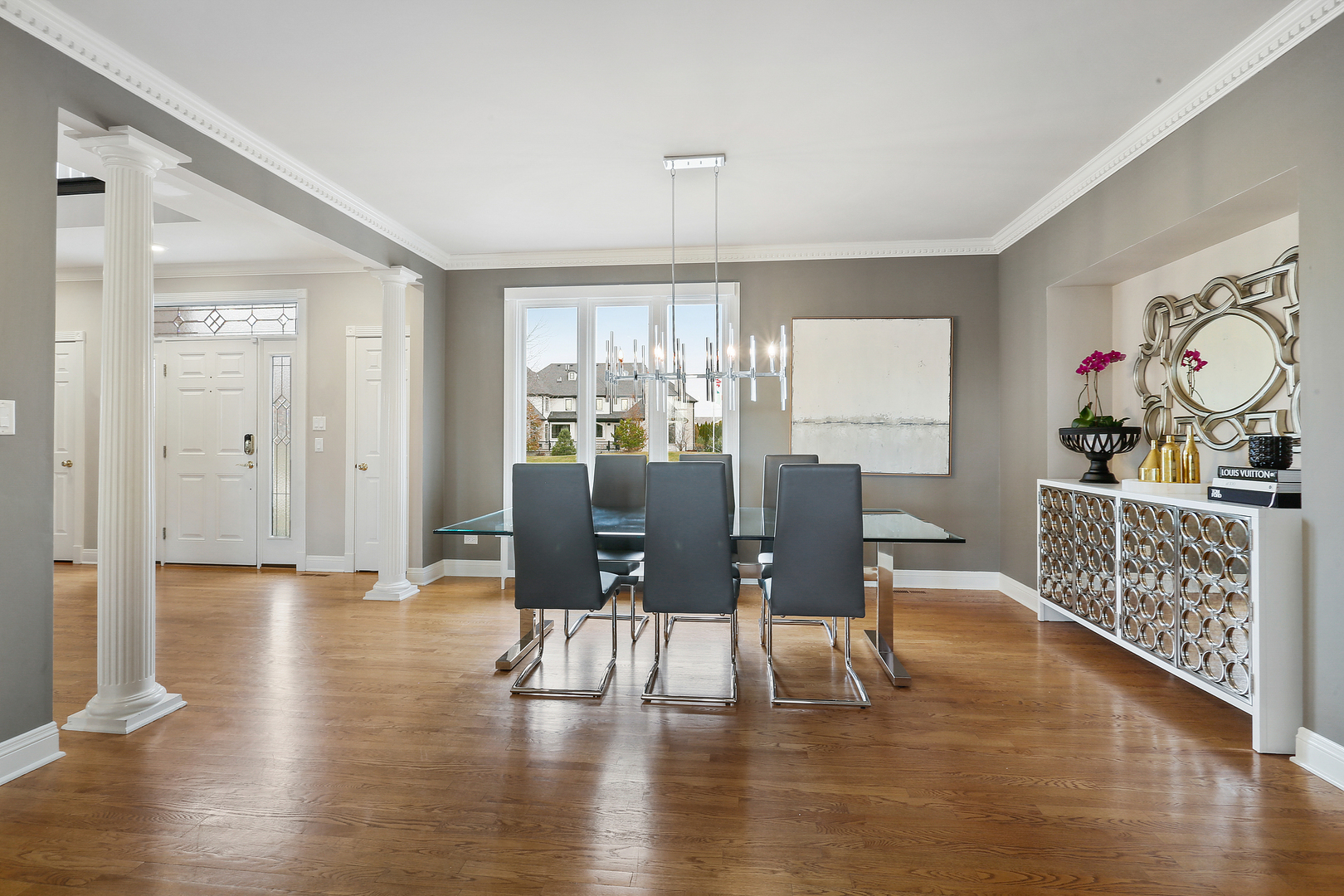 65 Ruffled Feathers Drive Lemont, IL 60439 - Photo 15 of 44 a view of a dining room with furniture window and wooden floor