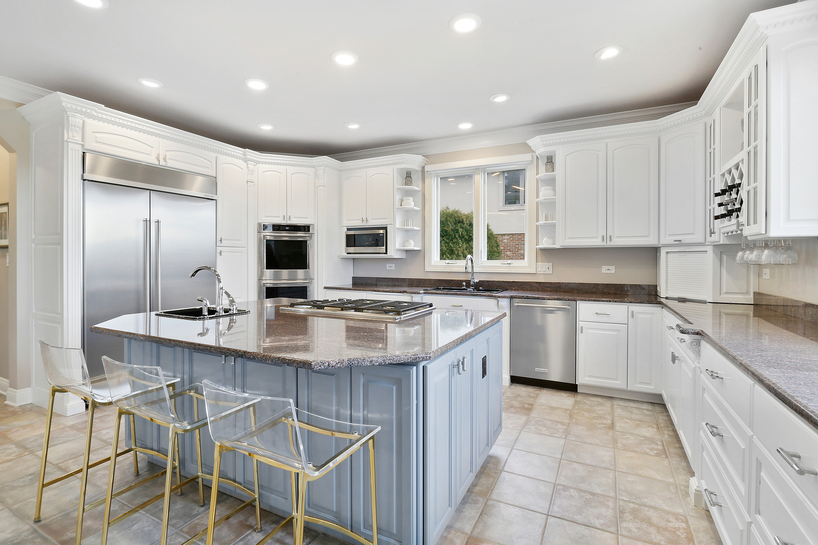 65 Ruffled Feathers Drive Lemont, IL 60439 - Photo 19 of 44 a kitchen with stainless steel appliances kitchen island granite countertop a sink and cabinets