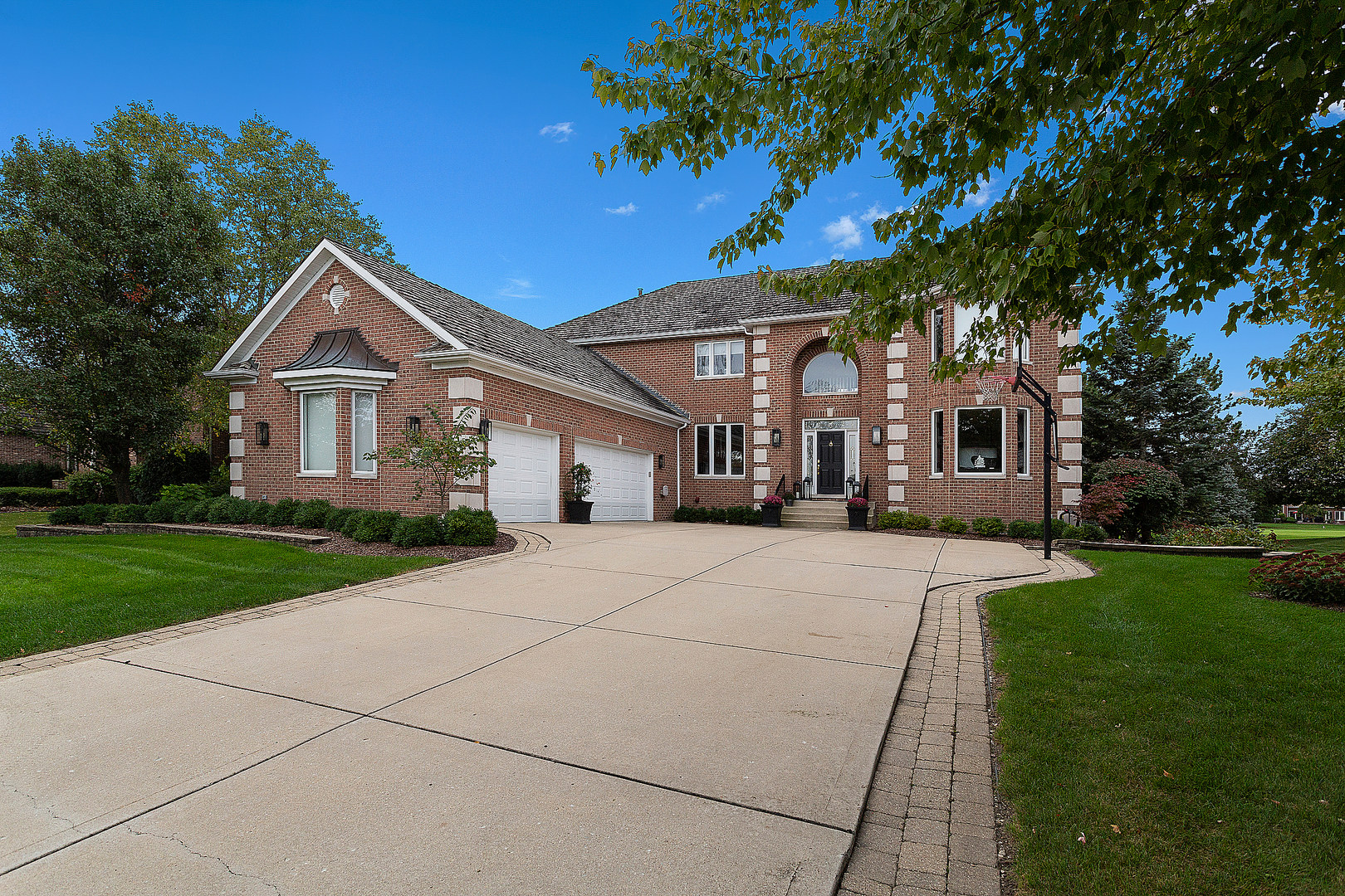 65 Ruffled Feathers Drive Lemont, IL 60439 - Photo 2 of 44 a front view of a house with a yard