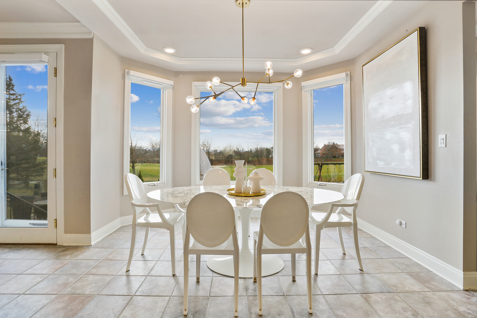 65 Ruffled Feathers Drive Lemont, IL 60439 - Photo 23 of 44 a dining room with furniture a chandelier and window