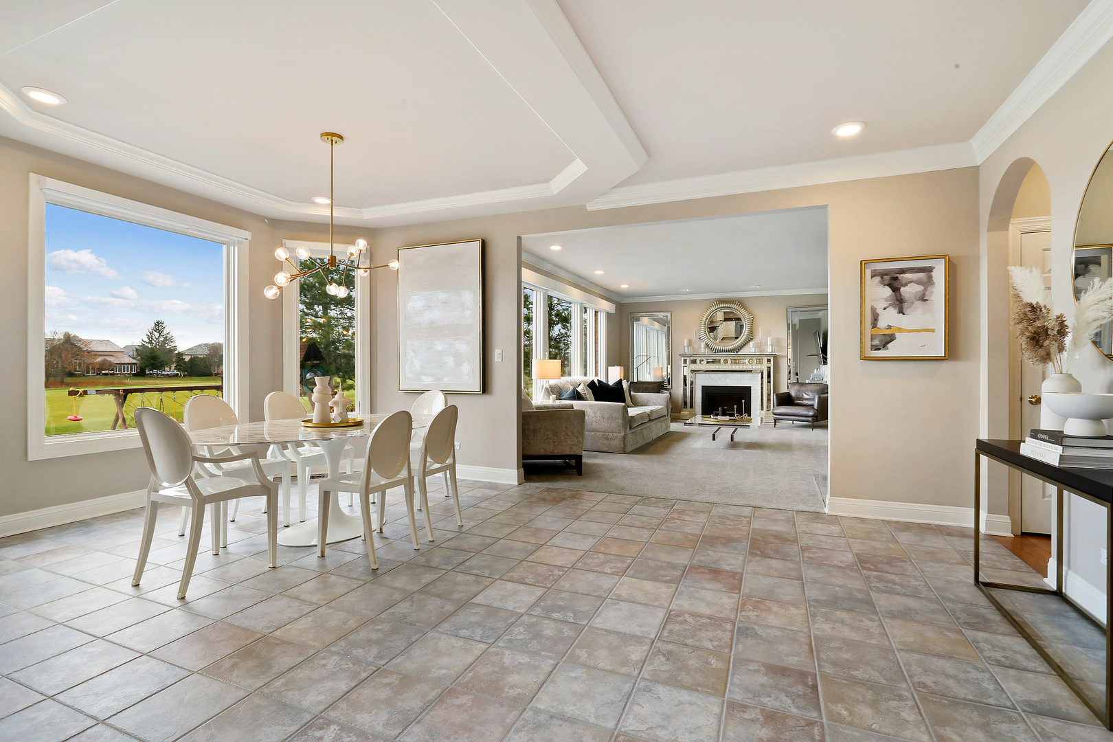 65 Ruffled Feathers Drive Lemont, IL 60439 - Photo 24 of 44 a view of a dining room with furniture large windows and wooden floor