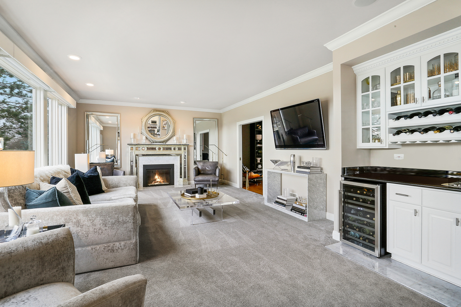 65 Ruffled Feathers Drive Lemont, IL 60439 - Photo 25 of 44 a living room with furniture a fireplace and a flat screen tv