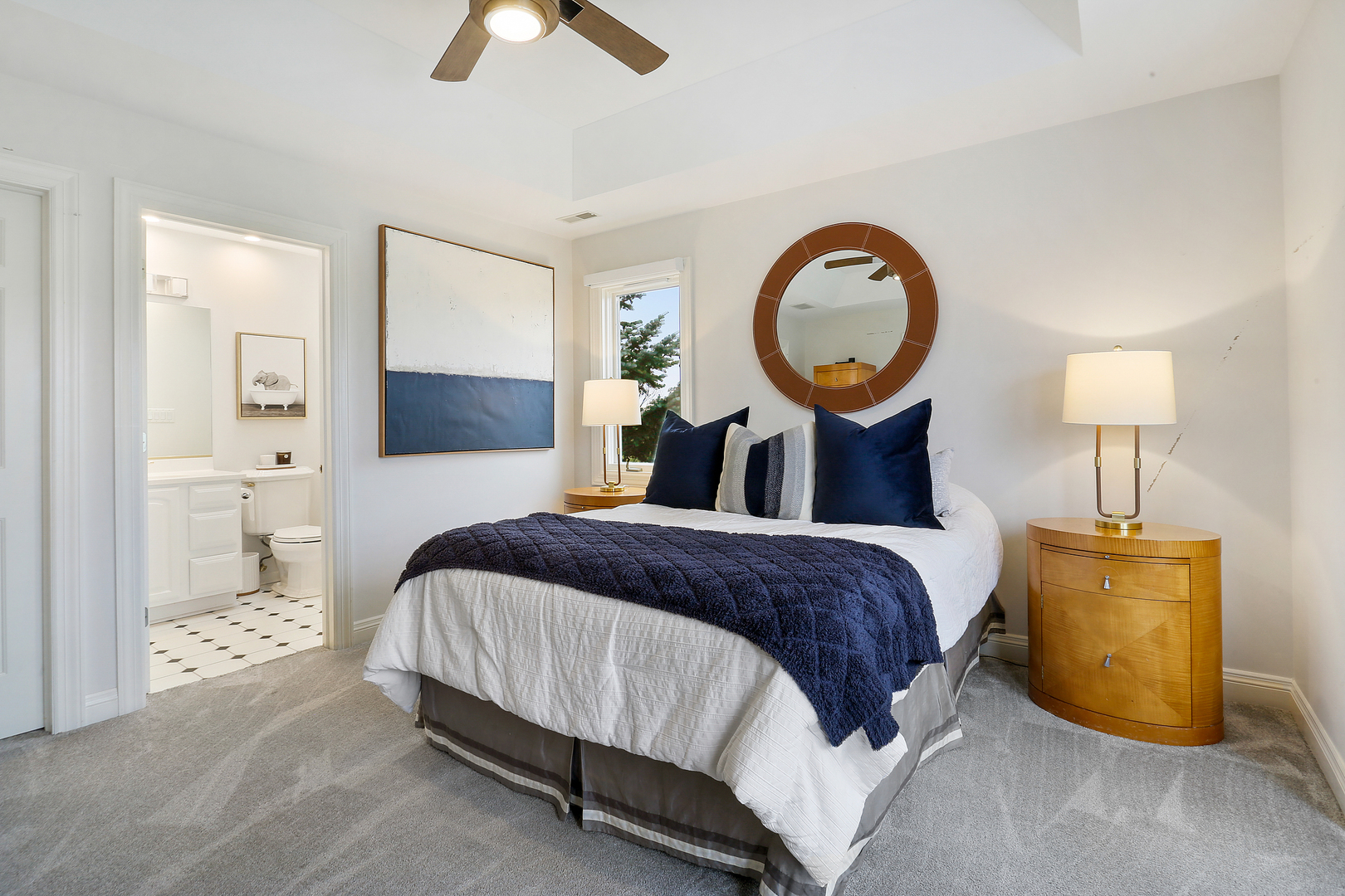 65 Ruffled Feathers Drive Lemont, IL 60439 - Photo 30 of 44 a bedroom with a bed and a chandelier