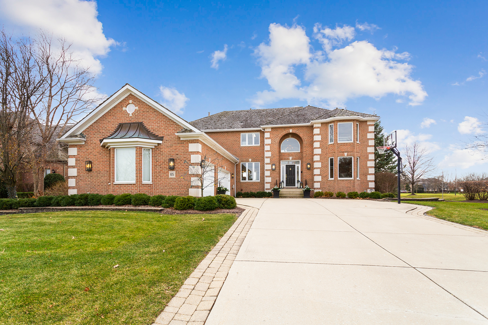 65 Ruffled Feathers Drive Lemont, IL 60439 - Photo 3 of 44 a front view of house with yard and green space