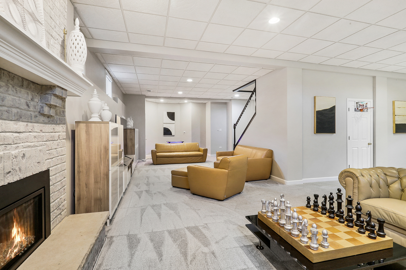 65 Ruffled Feathers Drive Lemont, IL 60439 - Photo 34 of 44 a living room with furniture and a fireplace