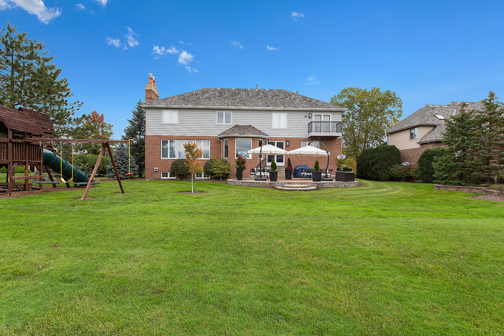 65 Ruffled Feathers Drive Lemont, IL 60439 - Photo 4 of 44 a front view of a house with garden