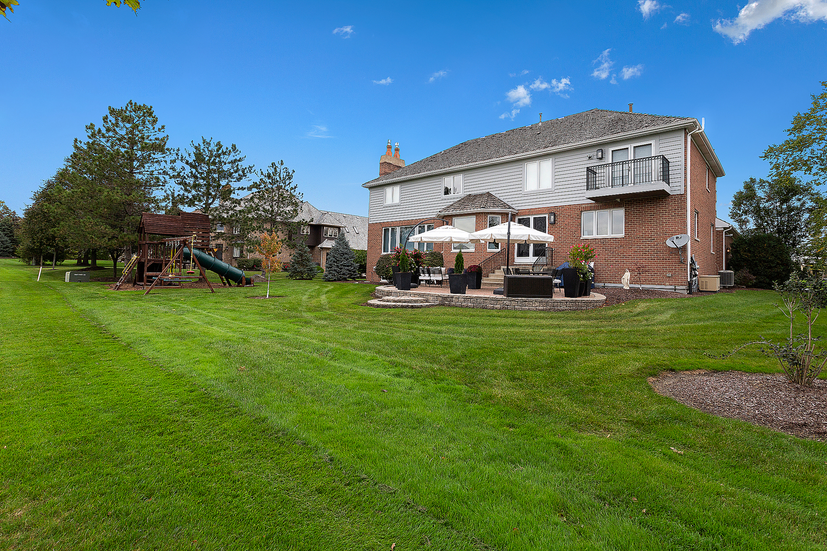 65 Ruffled Feathers Drive Lemont, IL 60439 - Photo 5 of 44 a front view of a house with a yard