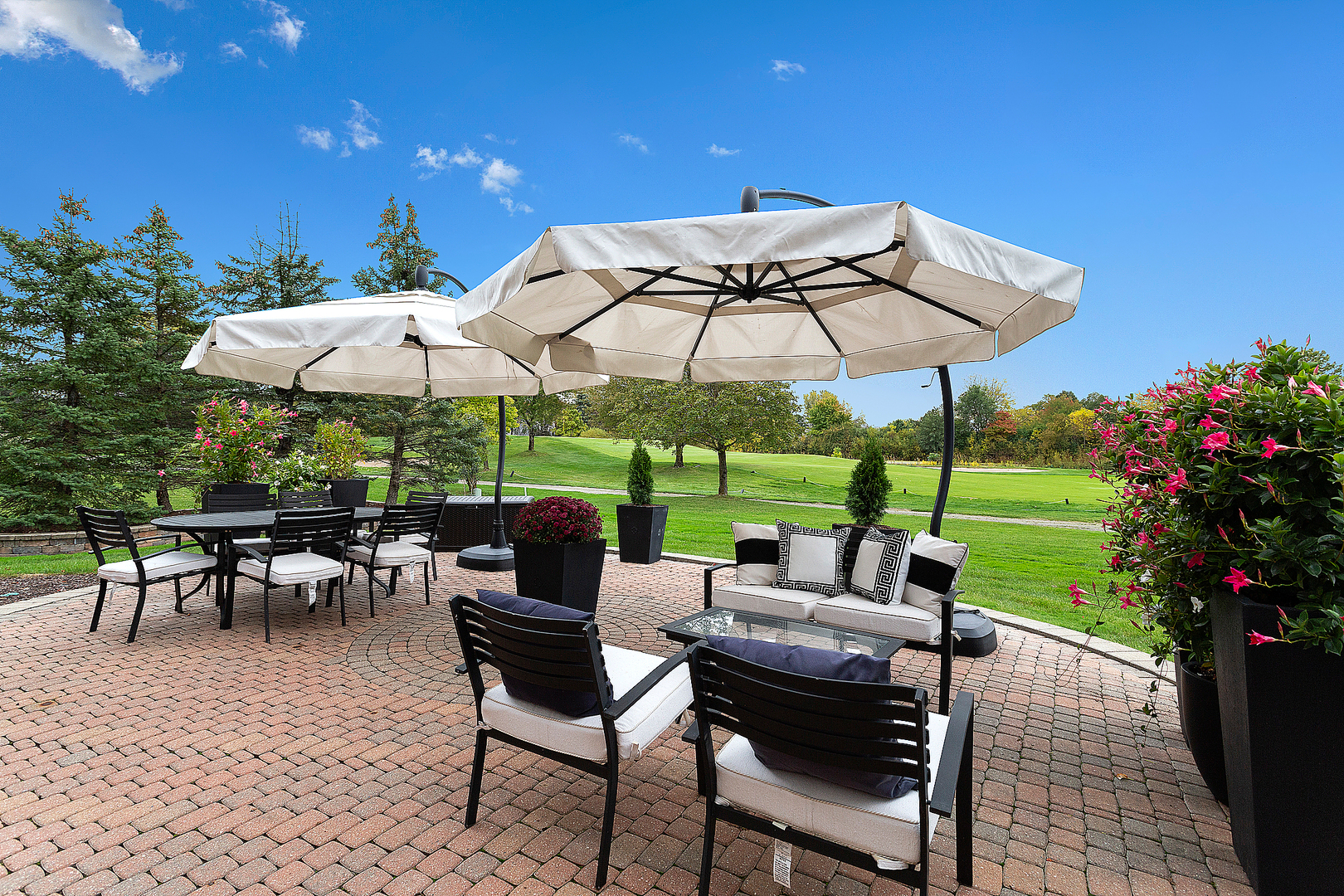 65 Ruffled Feathers Drive Lemont, IL 60439 - Photo 10 of 44 a view of a patio with chairs and a small yard
