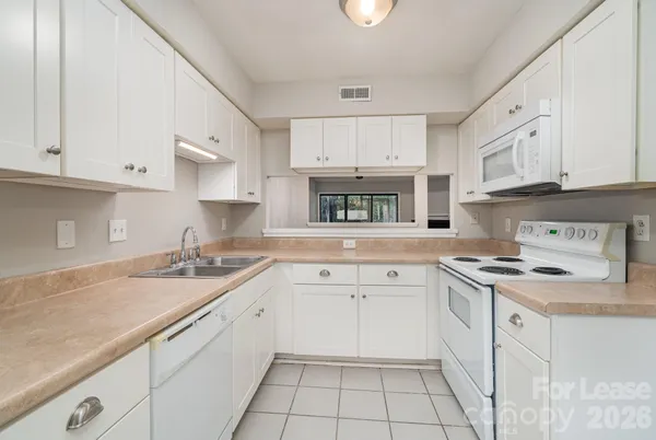 a bathroom with a sink vanity and a mirror