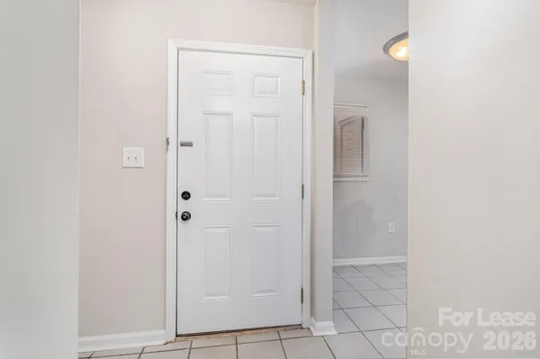 a view of an empty room with a fireplace