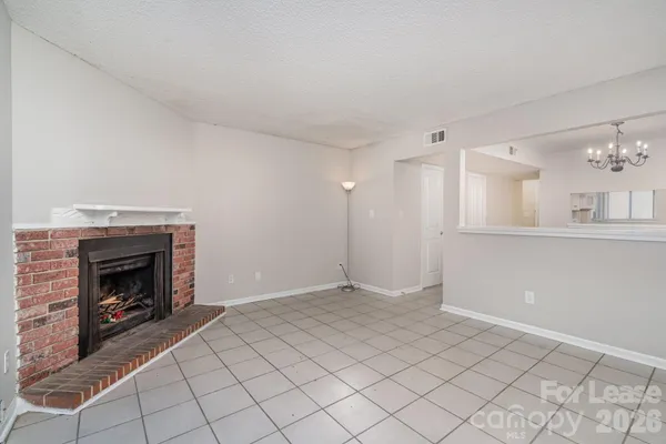 a view of an empty room and window