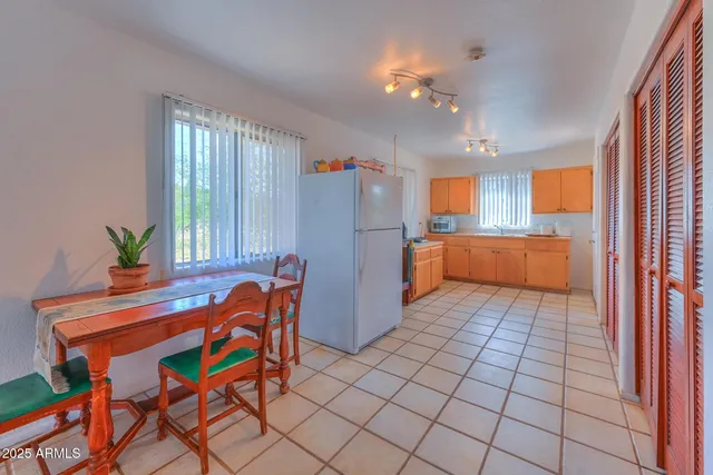 a kitchen with stainless steel appliances a sink stove and window