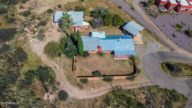 an aerial view of multiple houses with yard
