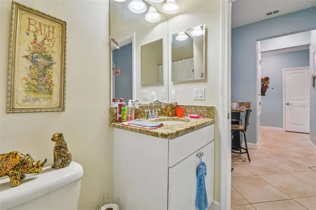 a spacious bathroom with a sink a mirror and a bathtub
