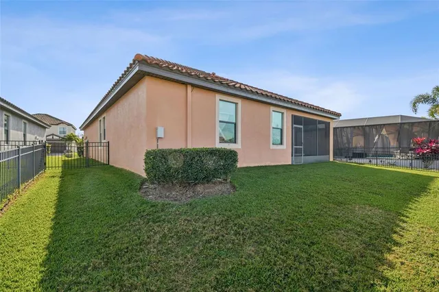 an aerial view of a house with a lake view
