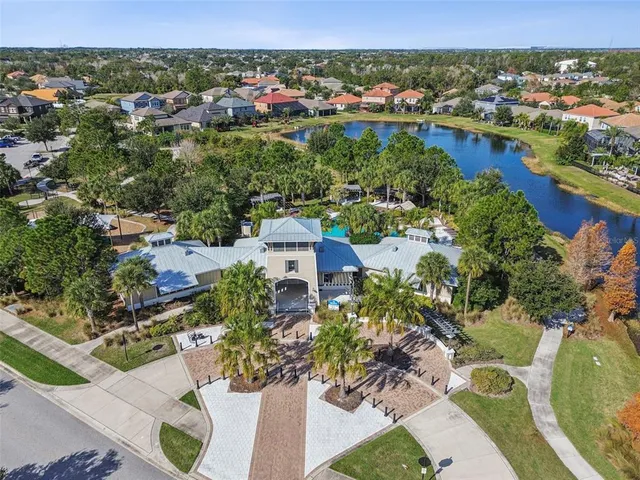 a view of a swimming pool with a yard and plants