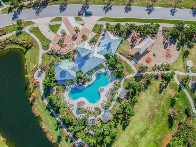 an aerial view of a house with outdoor space