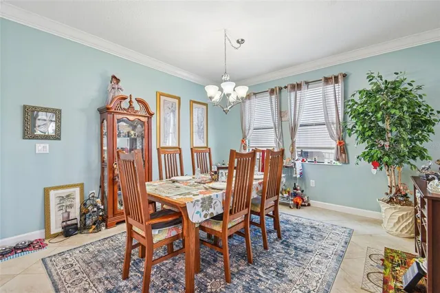 a view of a dining room with furniture and window