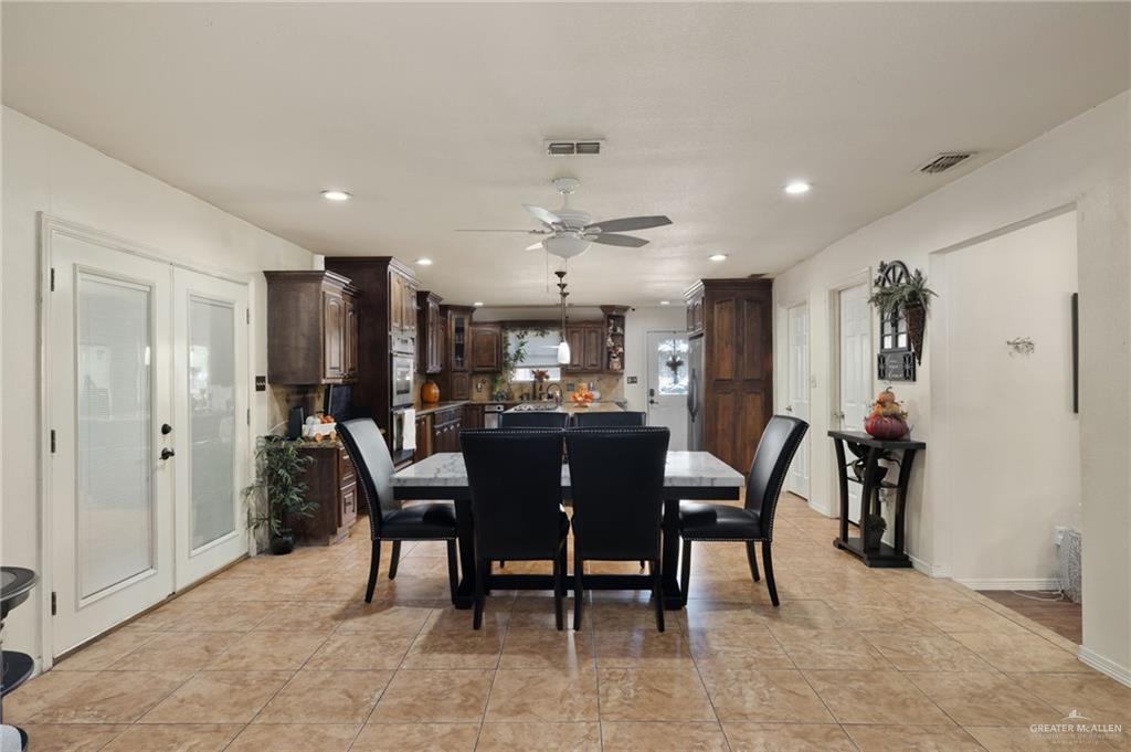 1222 South Bluebonnet Street Pharr, TX 78577 - Photo 5 of 17 a view of a dining room with furniture