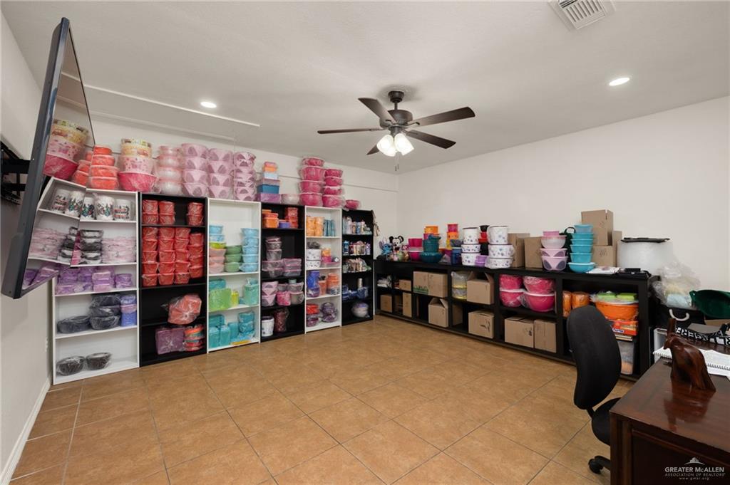 1222 South Bluebonnet Street Pharr, TX 78577 - Photo 7 of 17 a view of a storage area with a garage