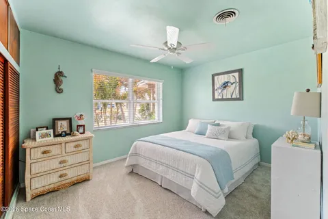 a bedroom with a bed and a cabinets