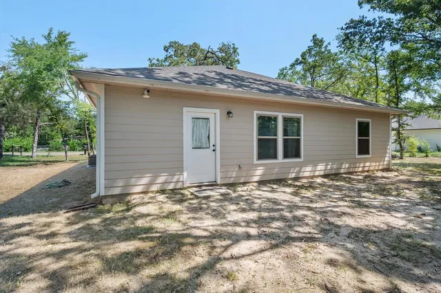 a view of a house with a tree