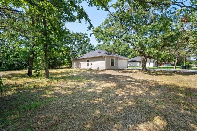 a house view with a garden space