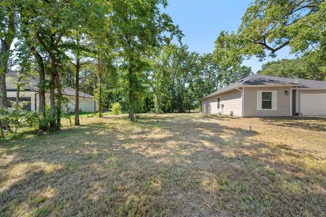 a backyard of a house with lots of green space